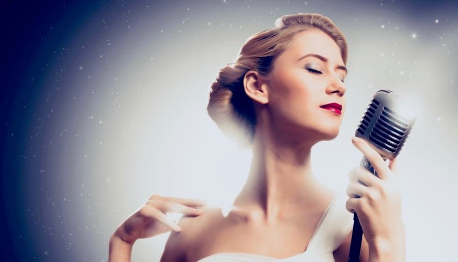 Woman Performer with 1940s hair & vintage microphone