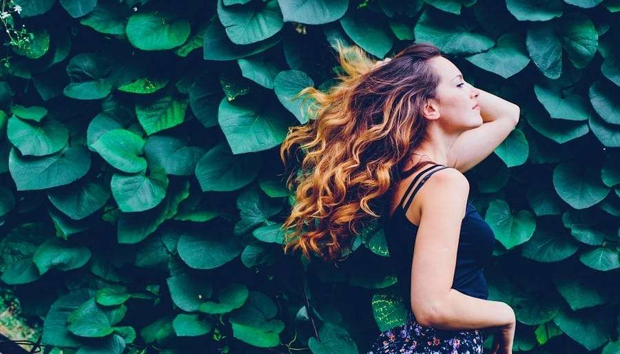 Heart-Chakra-Woman Woman and Leafy Green Wall