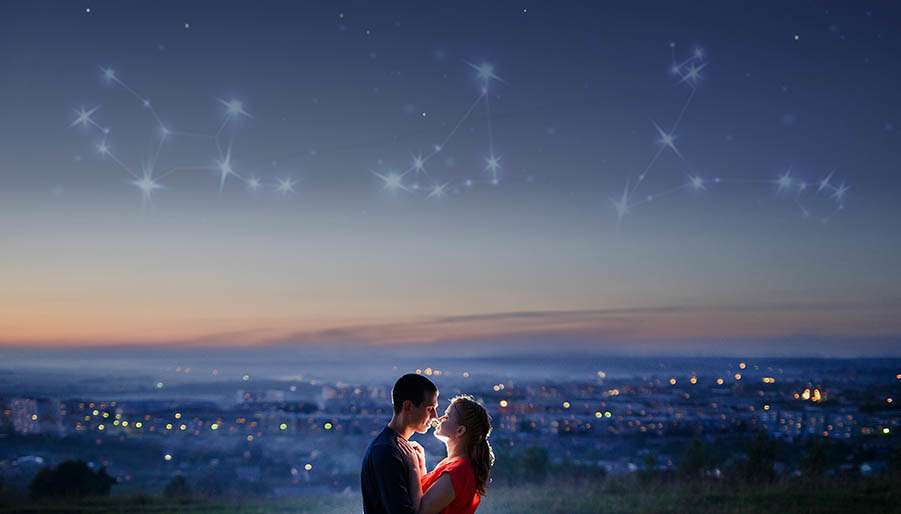crush couple standing under starry sky with zodiac signs
