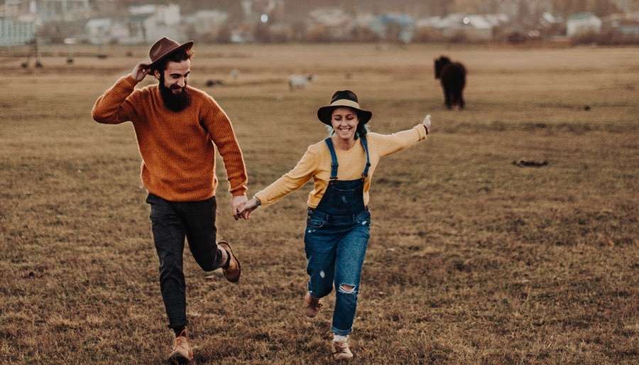 Venus-in-Sagittarius Couple Running Free at a Festival - Sagittarius Love