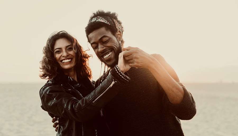 Venus-in-LEO Happy, Laughing Couple wearing Leather Jackets