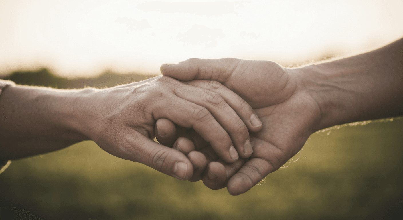 Intertwined hands in morning light symbolizing love. Intertwined hands in morning light symbolizing love.